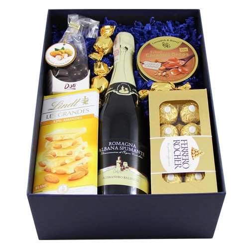 Upominek z szampanem dla kobiety na prezent dla koleżanki z pracy pomysł na prezent dla niej szampan na prezent